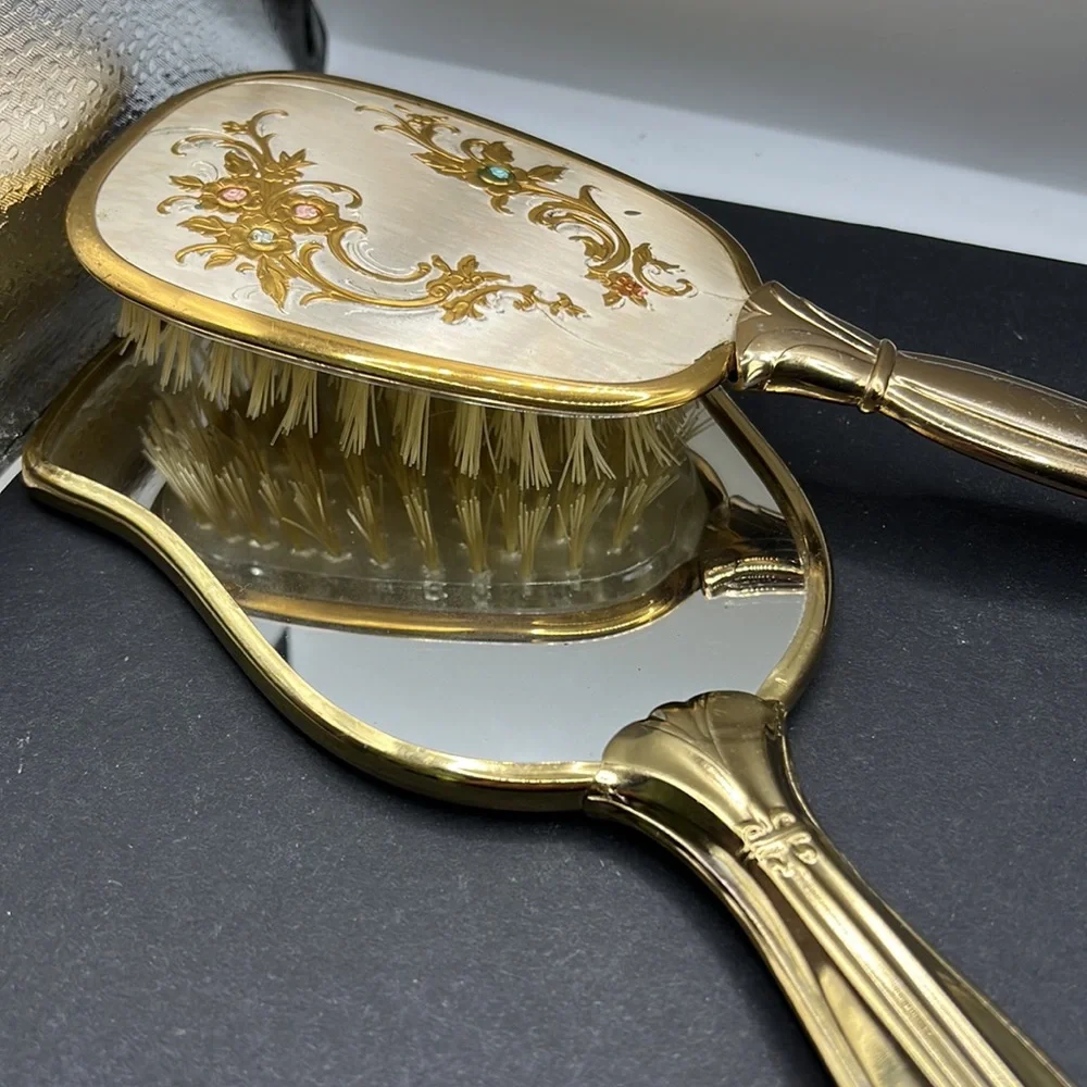 Vintage vanity hand mirror and brush